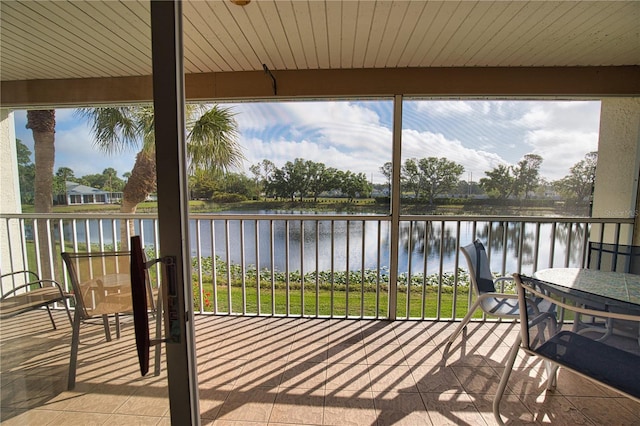 201 Silver Lake Dr Unit 204, Venice, FL 34292 - sunroom featuring a water view
