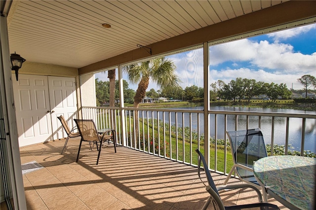 201 Silver Lake Dr Unit 204, Venice, FL 34292 - sunroom with a water view