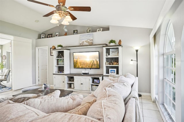 living room featuring light tile patterned floors, ceiling fan, and lofted ceiling