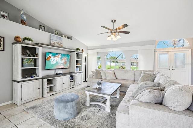 living room featuring french doors, vaulted ceiling, ceiling fan, and light tile patterned flooring