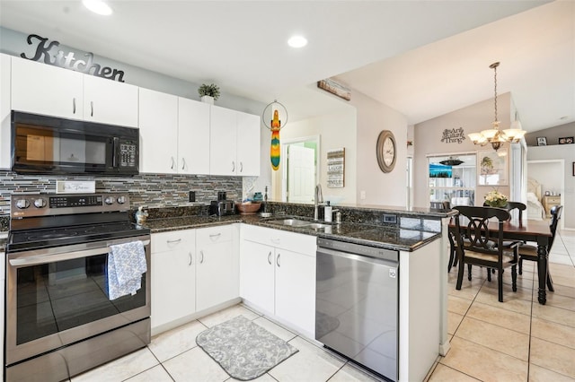 kitchen with white cabinetry, stainless steel appliances, backsplash, a chandelier, and pendant lighting