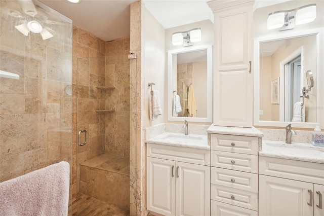 bathroom featuring vanity and a shower with shower door