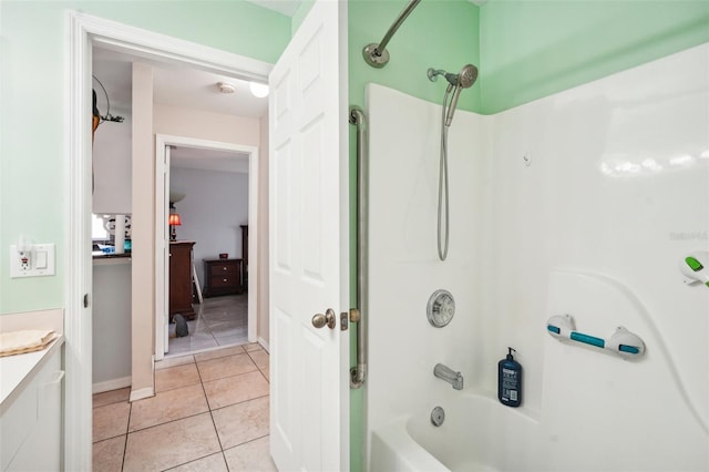 bathroom with shower / bathing tub combination, tile patterned flooring, and vanity