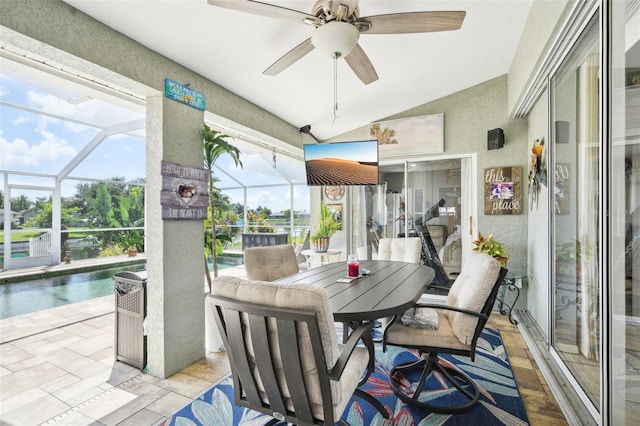 sunroom with ceiling fan and lofted ceiling