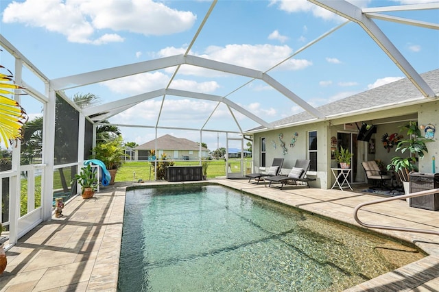 view of pool with a lanai and a patio