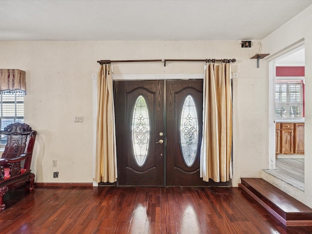 foyer featuring french doors and dark hardwood / wood-style floors