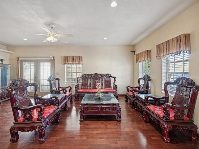 living room with french doors, dark hardwood / wood-style floors, ceiling fan, and a healthy amount of sunlight