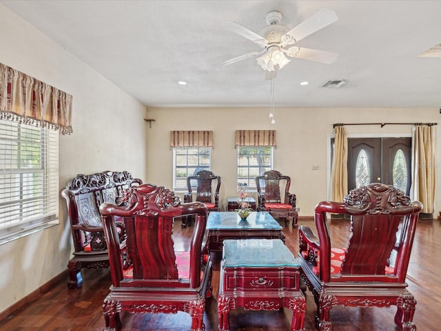 living room with wood-type flooring, french doors, a wealth of natural light, and ceiling fan