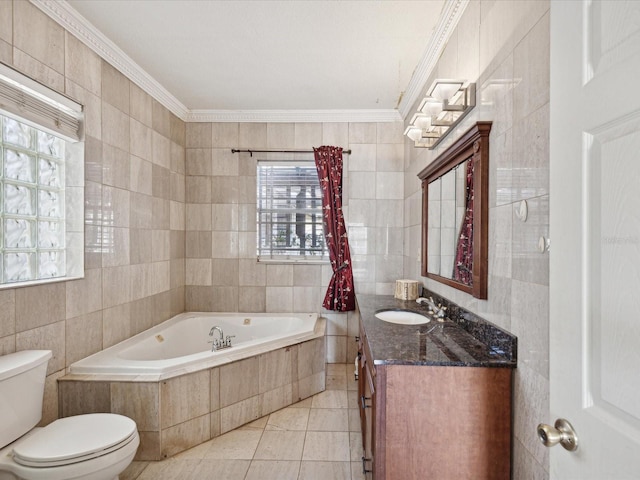 bathroom featuring vanity, toilet, ornamental molding, tile walls, and tiled tub