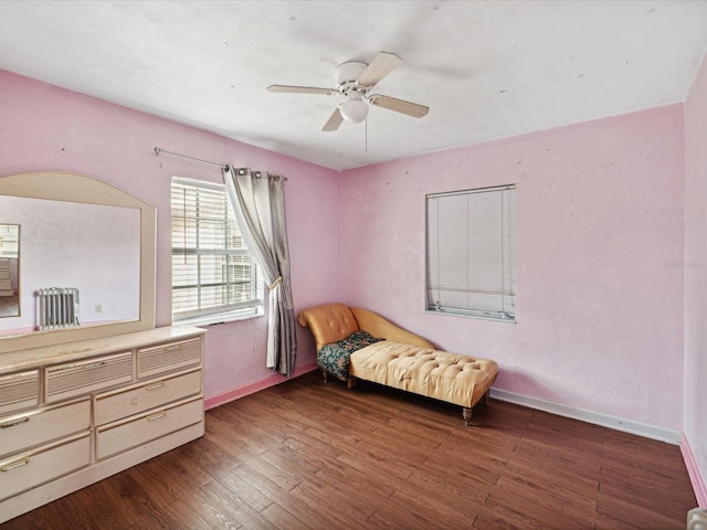 bedroom with ceiling fan and dark hardwood / wood-style floors