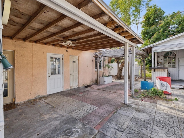 view of patio / terrace with a pergola and ceiling fan