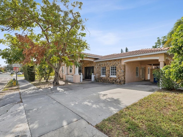 view of front of home featuring a carport