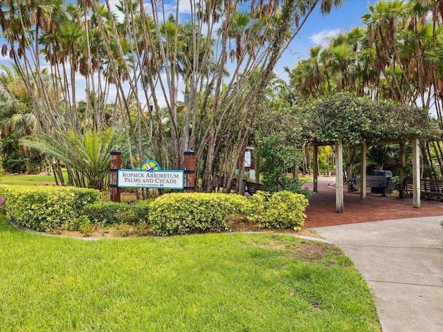 view of property's community with a lawn