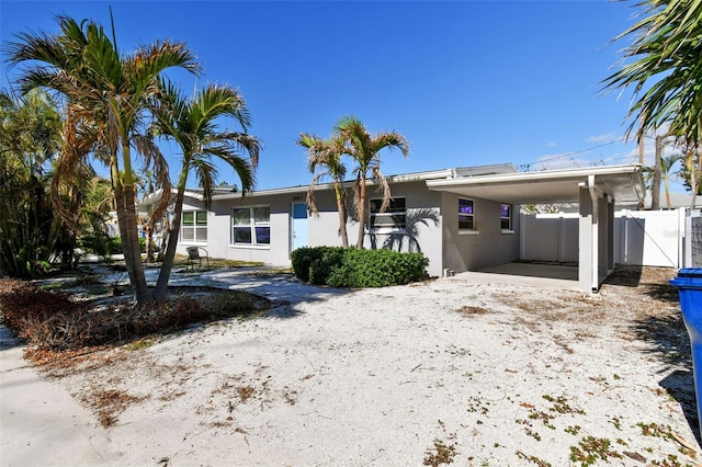 view of front of home featuring a carport