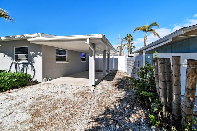 view of side of home featuring a patio