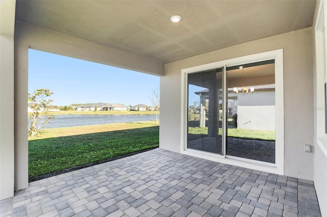 view of patio featuring a water view