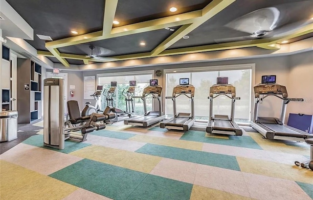 workout area with coffered ceiling and recessed lighting