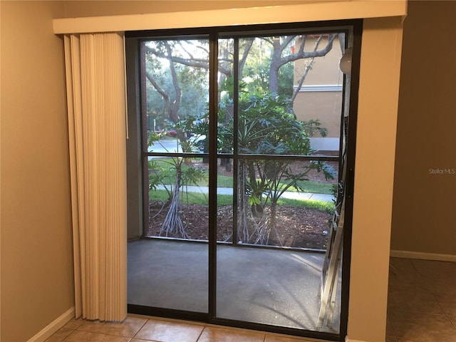 doorway to outside featuring light tile patterned floors