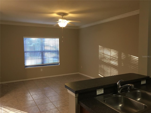 kitchen with ceiling fan, light tile patterned flooring, crown molding, and sink