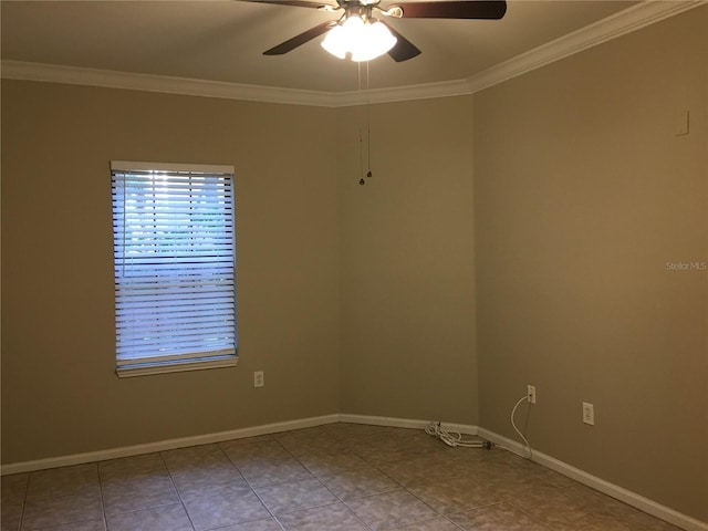 empty room with ceiling fan, ornamental molding, and light tile patterned floors