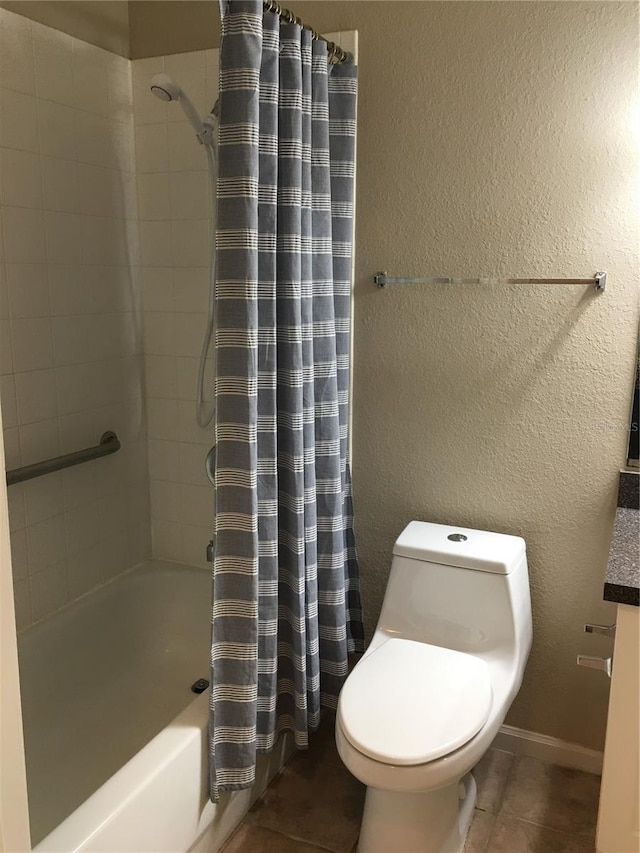 bathroom featuring tile patterned floors, toilet, and shower / tub combo with curtain