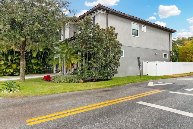 view of home's exterior with a lawn