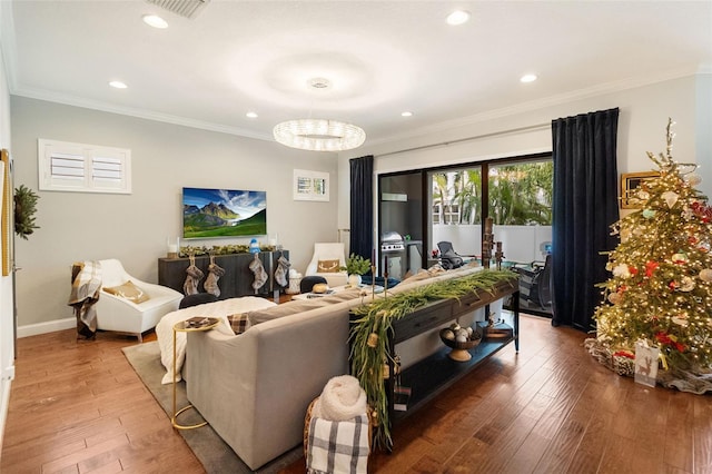 living room featuring hardwood / wood-style floors and ornamental molding