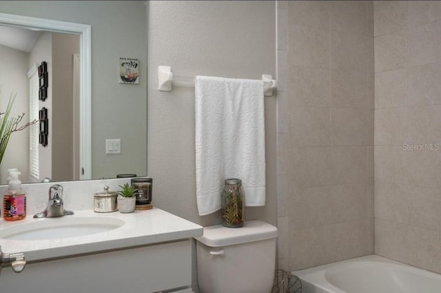 full bathroom with vanity, toilet, and tiled shower / bath combo