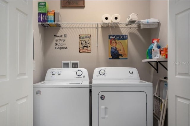 clothes washing area with washer and clothes dryer