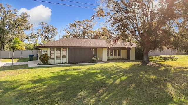 ranch-style house with a front yard