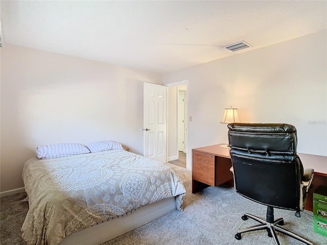 bedroom featuring light colored carpet