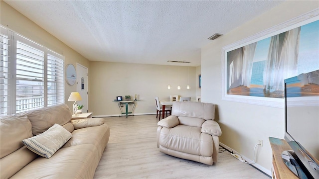 living room featuring a textured ceiling