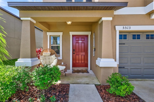 doorway to property featuring a garage