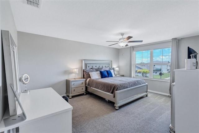 bedroom featuring light colored carpet and ceiling fan