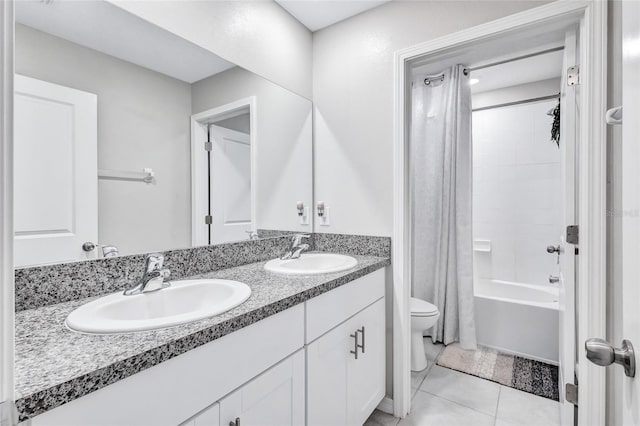 full bathroom featuring tile patterned floors, vanity, shower / tub combo, and toilet