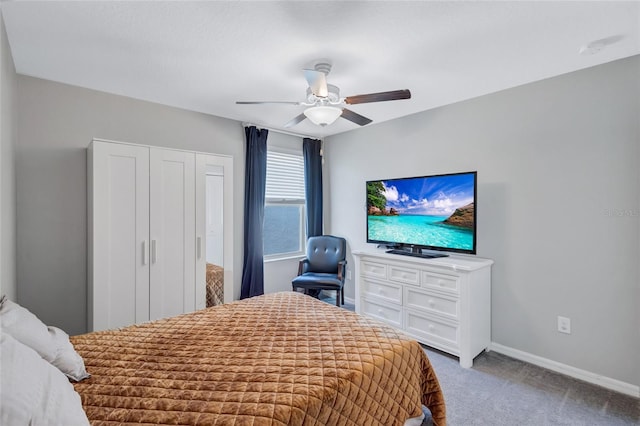 carpeted bedroom with ceiling fan