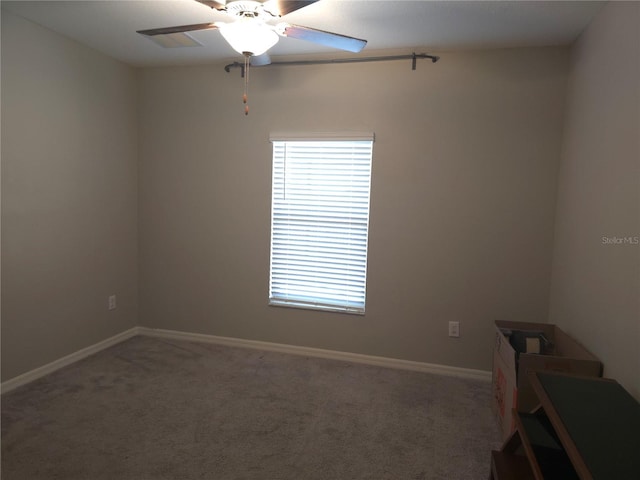 carpeted empty room with ceiling fan