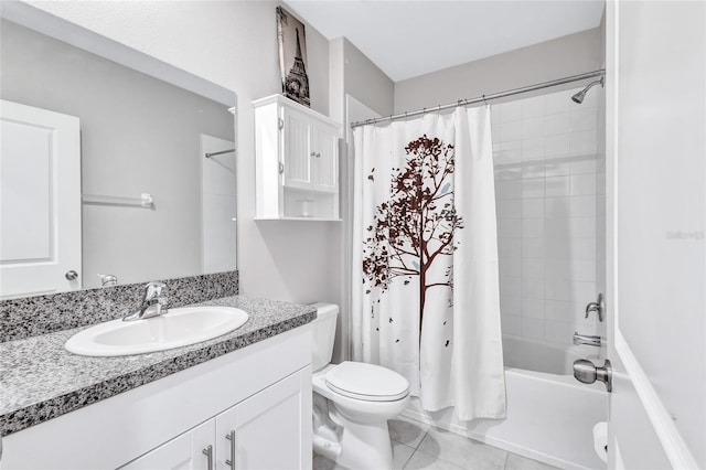 bathroom featuring vanity, shower / bath combo with shower curtain, tile patterned flooring, and toilet