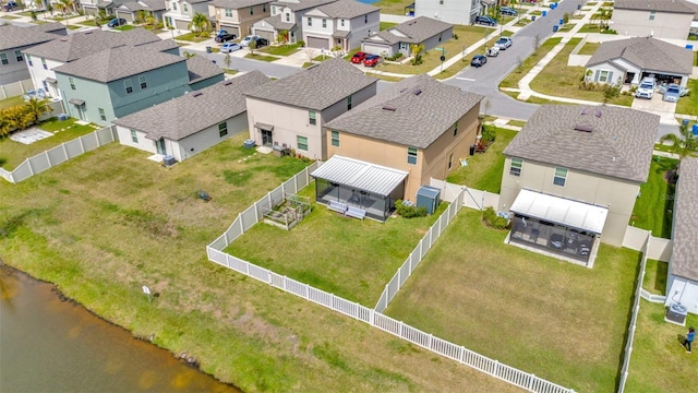 birds eye view of property with a residential view