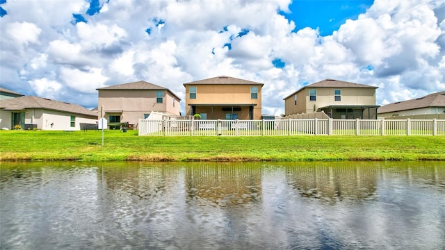 view of water feature with fence and a residential view