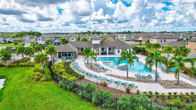 exterior space featuring a patio, a yard, fence, and a residential view