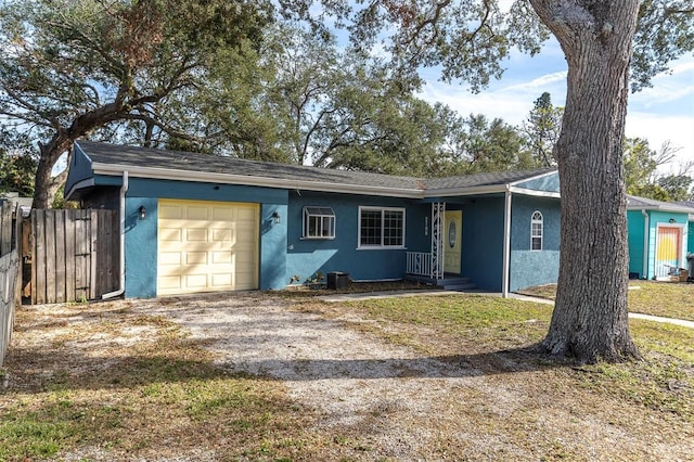 ranch-style home featuring a garage