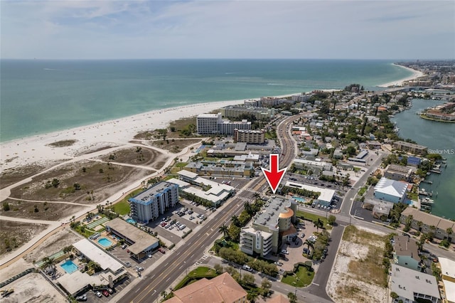 drone / aerial view featuring a view of the beach and a water view