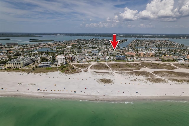 birds eye view of property featuring a view of the beach and a water view