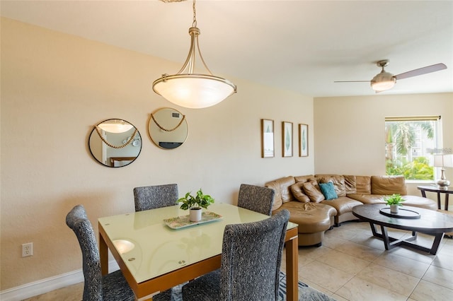 11605 Gulf Blvd Unit 307, Saint Petersburg, FL 33706 - dining room featuring a ceiling fan and light tile patterned floors