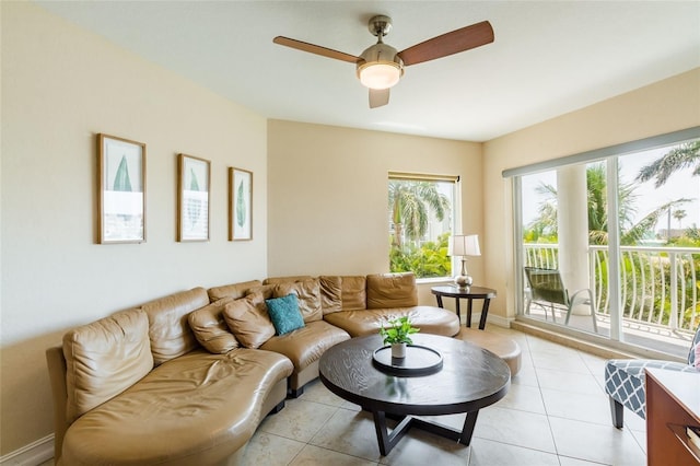 tiled living room featuring ceiling fan