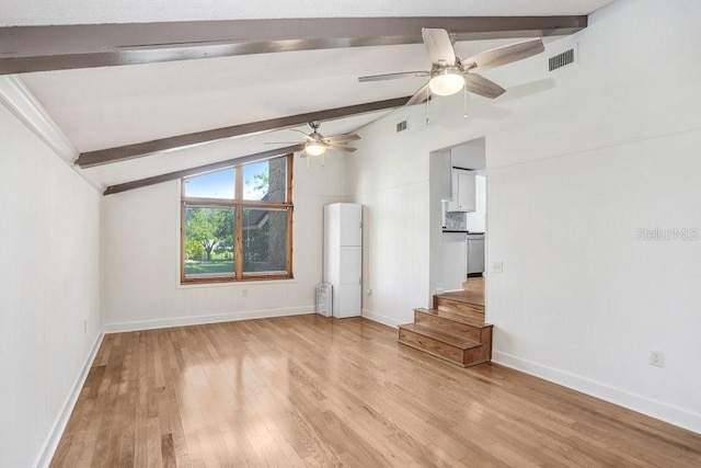 empty room featuring vaulted ceiling with beams, light hardwood / wood-style floors, and ceiling fan