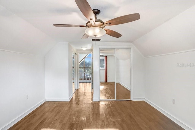 bonus room with hardwood / wood-style flooring, ceiling fan, and lofted ceiling