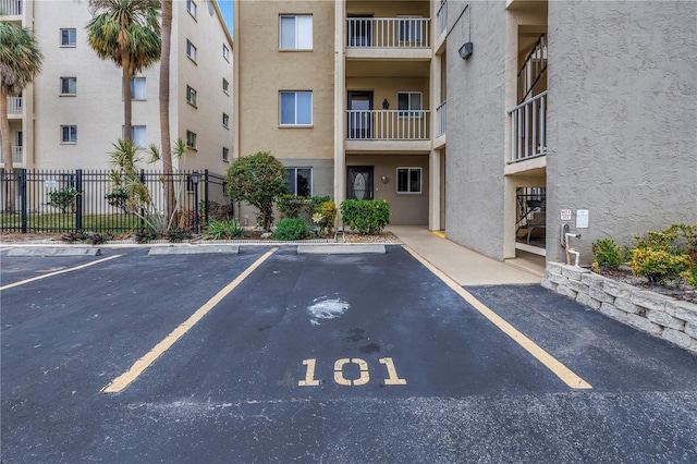 uncovered parking lot with fence