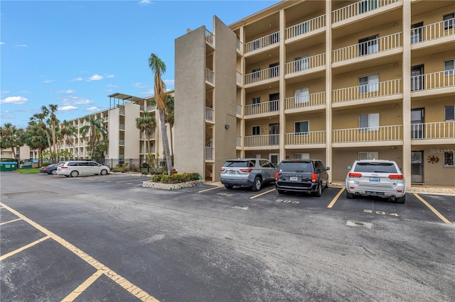 view of property with uncovered parking